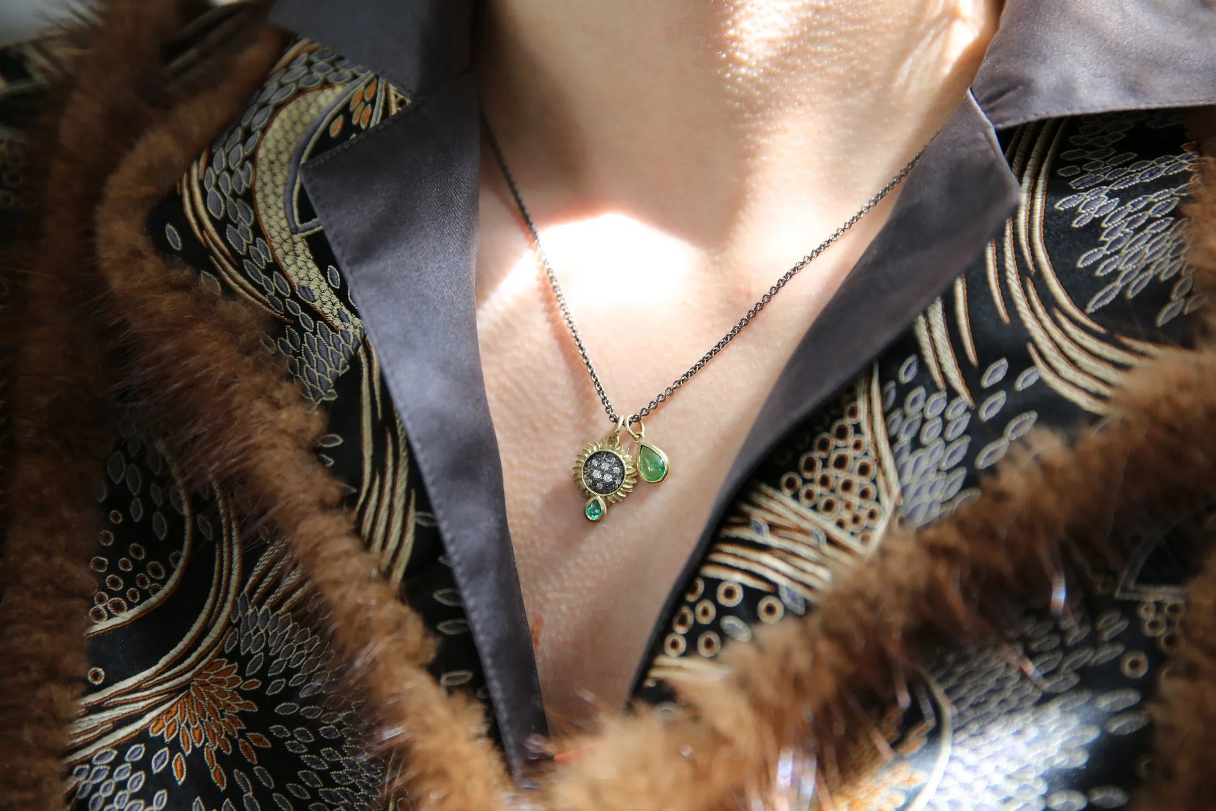 Small Pave Diamond Sunflower with Emerald Teardrop Necklace & Tsavorite Teardrop Charm on white female model | Rebecca Myers Collection