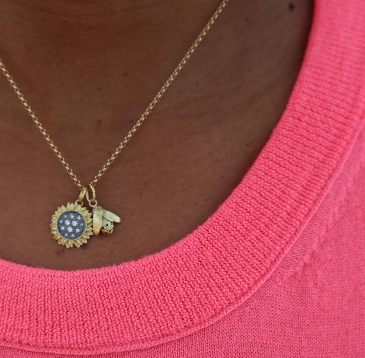 Medium Pave Diamond Sunflower Necklace with Medium Bee Charm on black female model | Rebecca Myers Collection