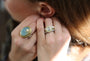 Natural Diamond Halo Ring on white female model with red hair | Rebecca Myers Collection