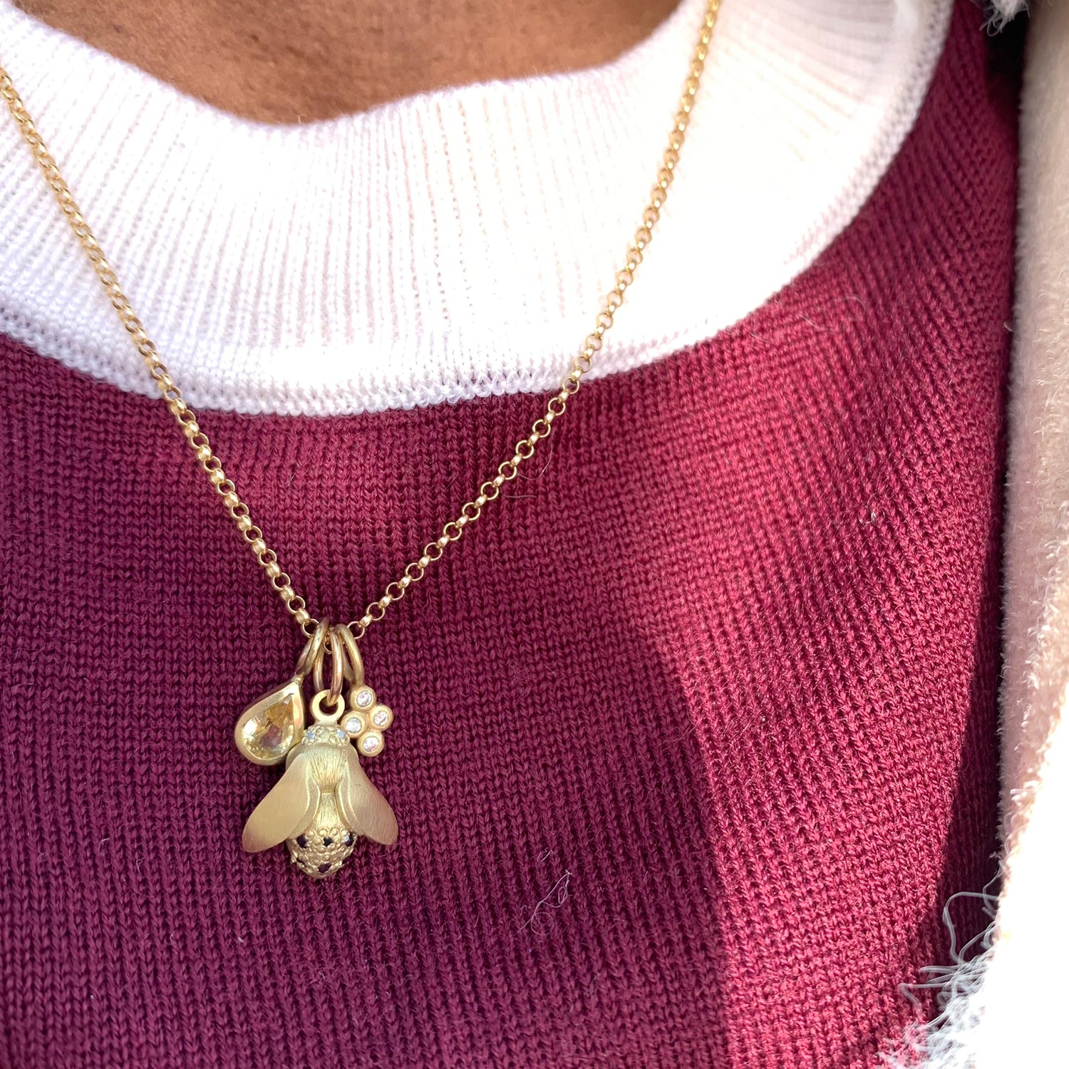 1.9mm 14k Yellow Gold Rolo Chain on female model in red sweater | Rebecca Myers Collection