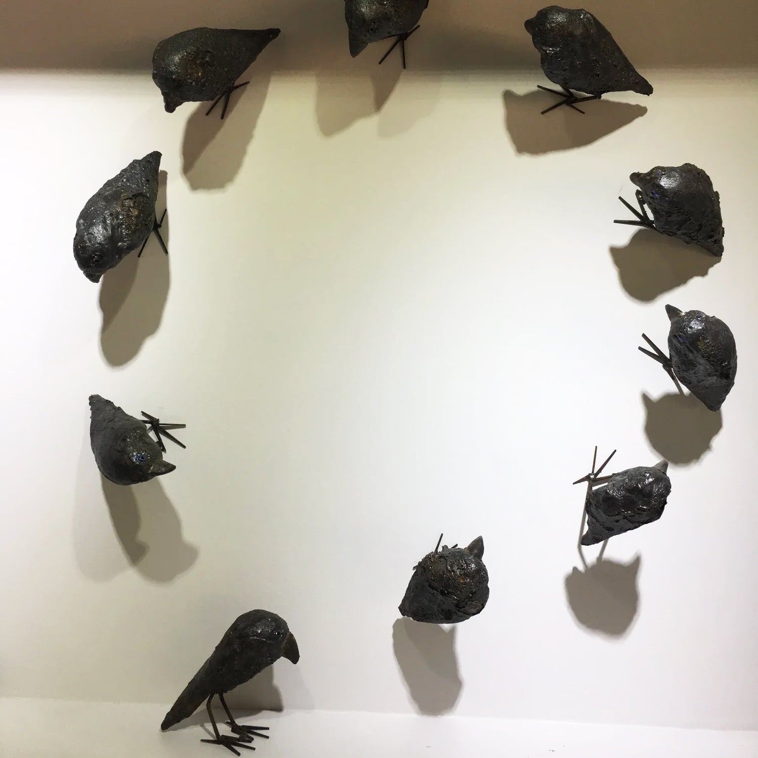 Ceramic Raven Sculptures by Mark Chatterley, circular wall display | Rebecca Myers Collection
