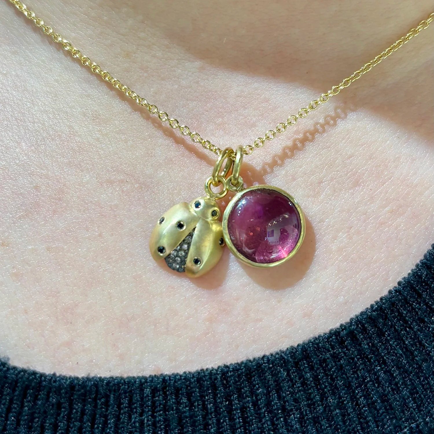 Ladybug Necklace with additional charm on white female model | Rebecca Myers Collection
