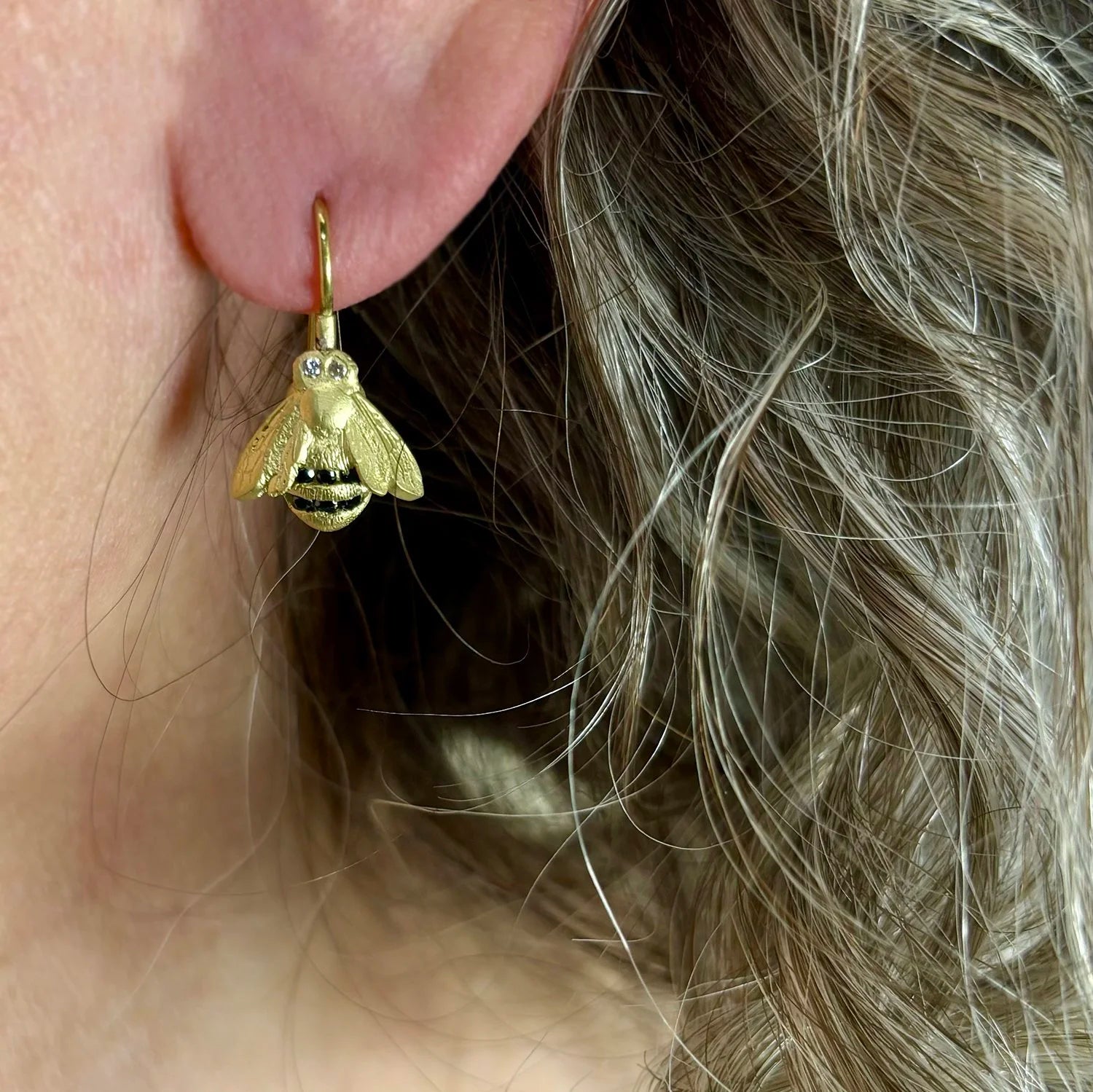 Medium Bumble Bee Earrings on white female model | Rebecca Myers Collection