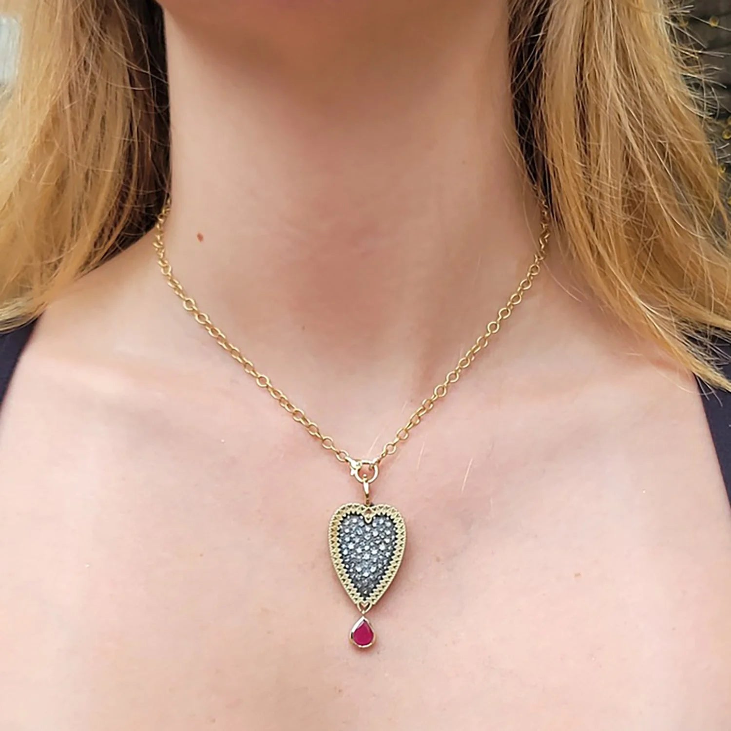 Large Framed Pave Diamond Heart Pendant with Ruby Drop on 18k Yellow Gold Chain on white female model | Rebecca Myers Collection