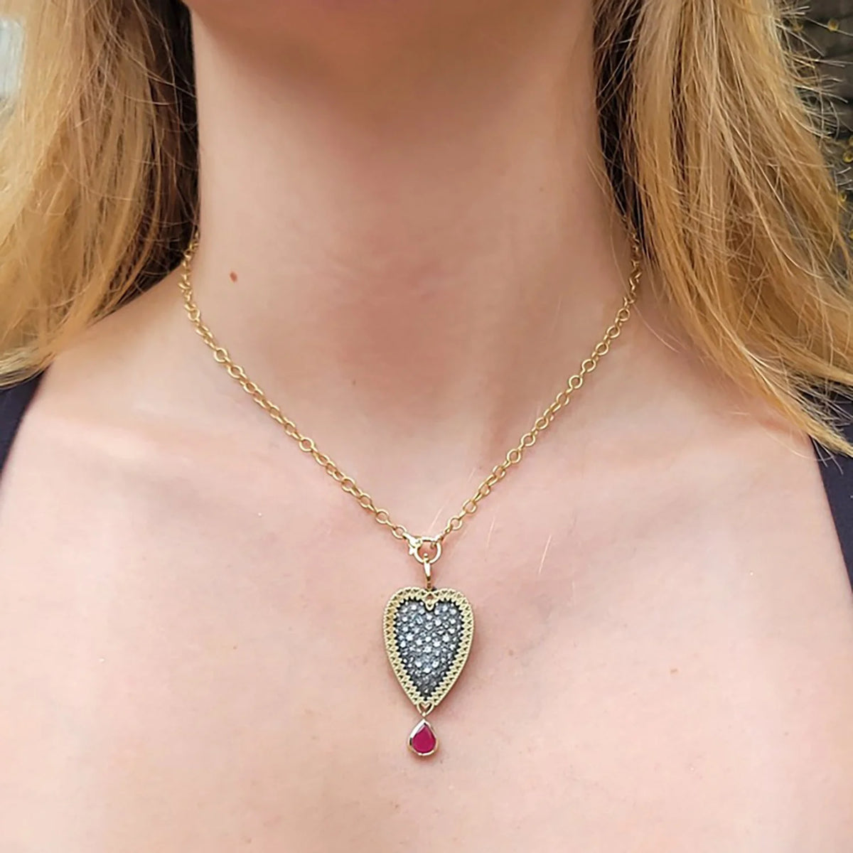 Large Framed Pave Diamond Heart Pendant with Ruby Drop on 18k Yellow Gold Chain on white female model | Rebecca Myers Collection