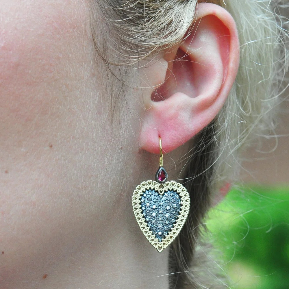 Large Framed Pave Diamond Heart Earrings with Ruby Tops on white female model | Rebecca Myers Collection