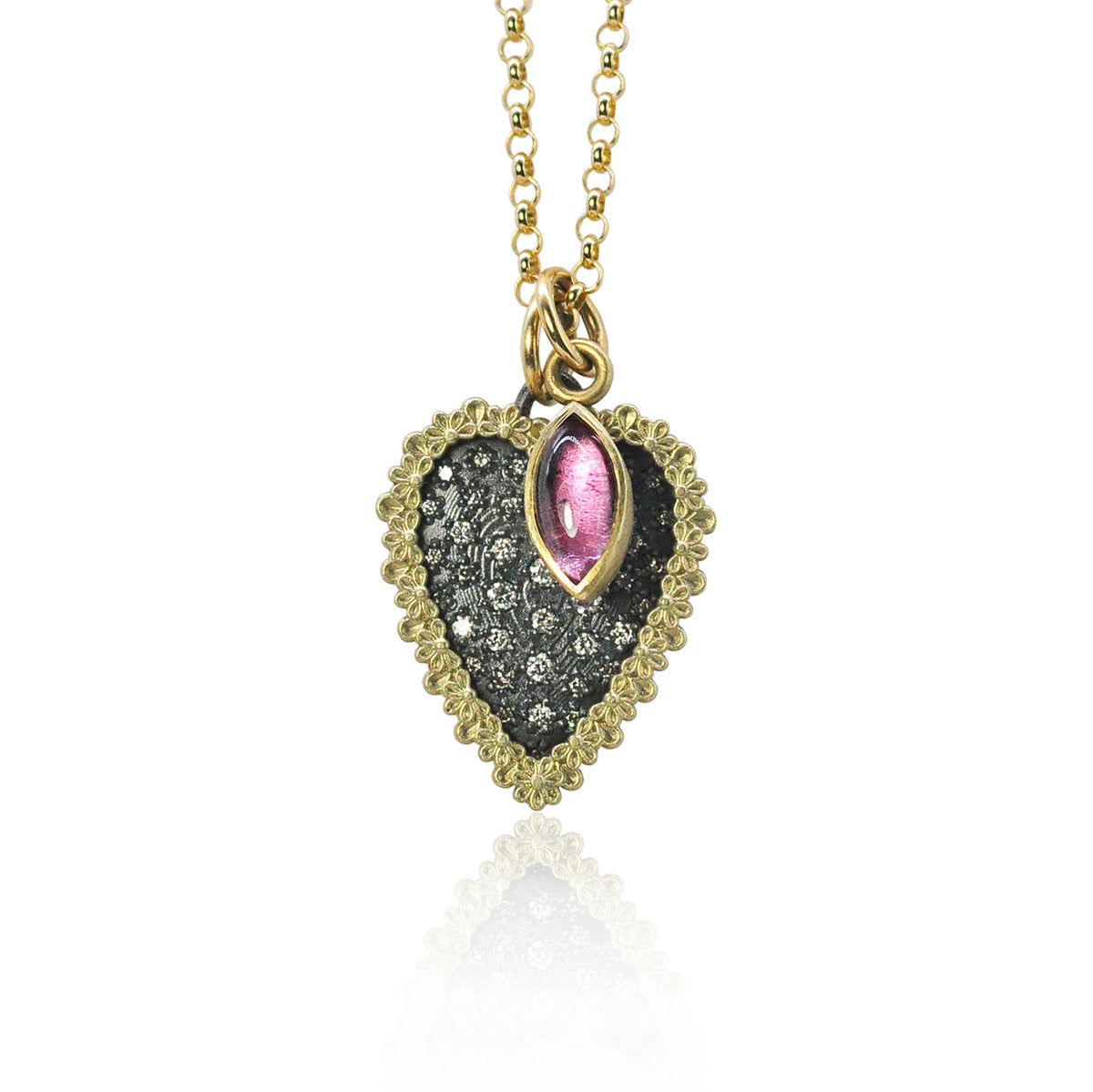 Heart-shaped pendant with pink tourmaline and gold chain on white background | Rebecca Myers Collection