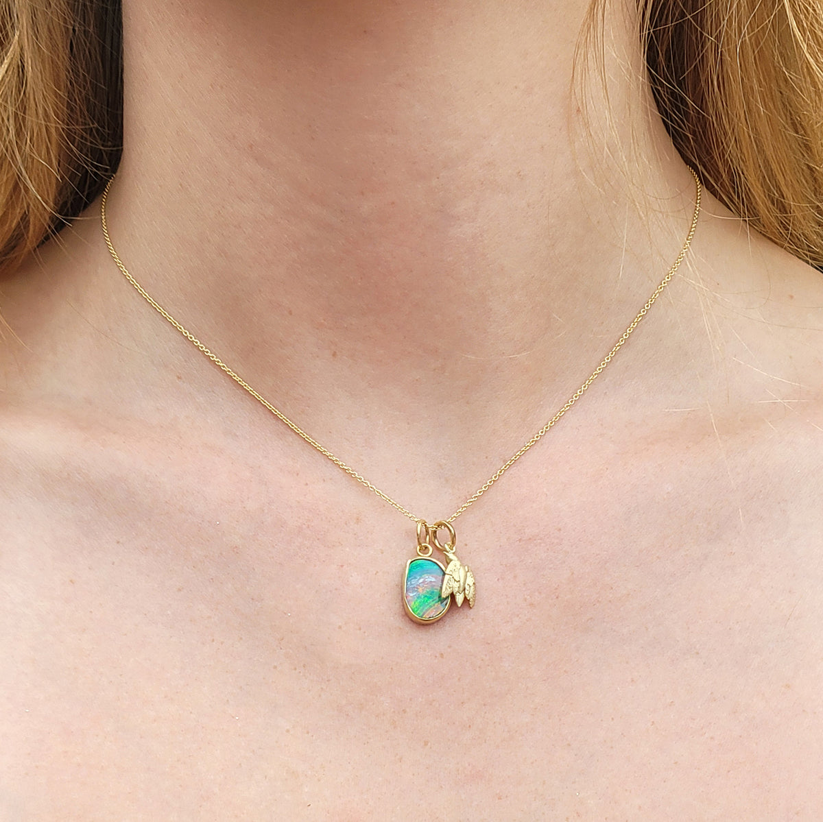 Medium Bird Charm on Gold Cable Chain with Medium Boulder Opal Charm on white female model | Rebecca Myers Collection