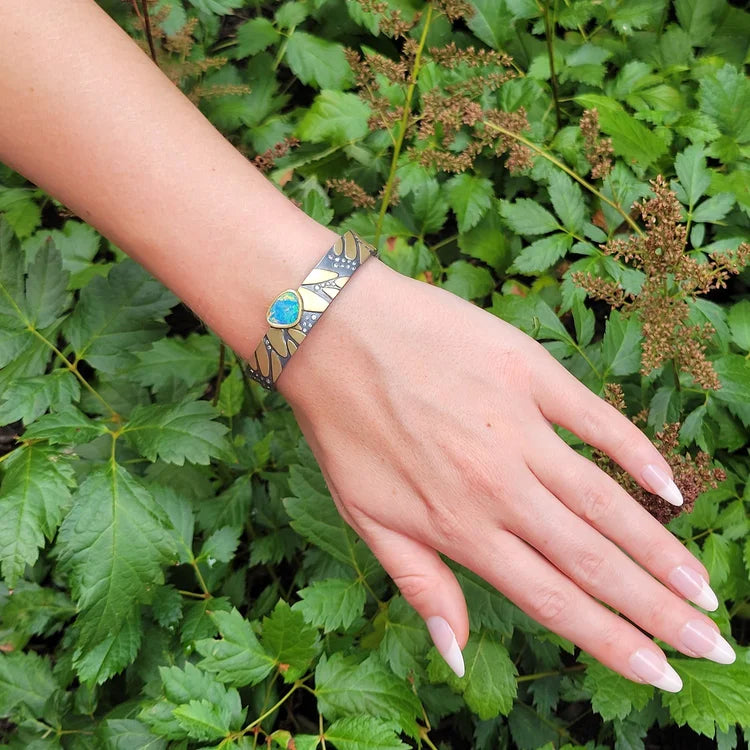Monarch Print Bracelets on white female model with green leaves background | Rebecca Myers Collection