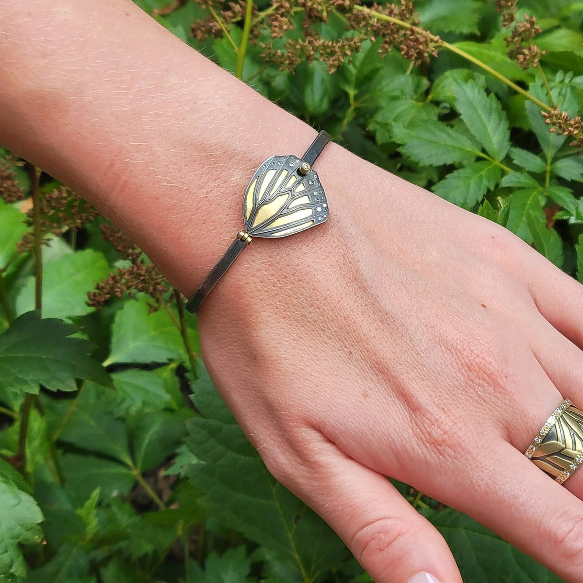 Gold & Silver Monarch Butterfly Wing Bracelet with Scattered Diamonds on white female model | Rebecca Myers Collection