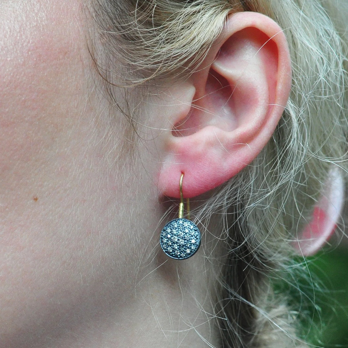 Large Oxidized Silver Pave Disc Earrings on wires on white female model with blonde hair | Rebecca Myers Collection