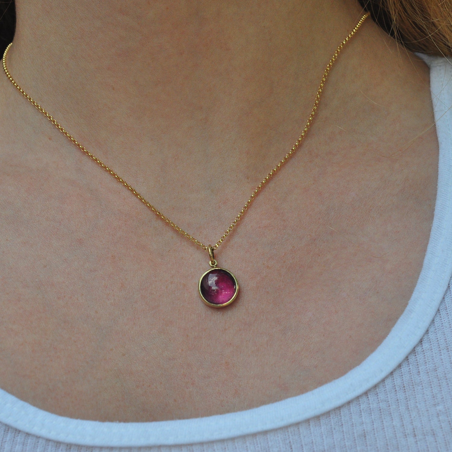 Round Pink Tourmaline Charm on Gold Chain on white female model | Rebecca Myers Collection