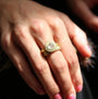 Natural Diamond Halo Ring on white female model | Rebecca Myers Collection