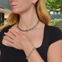Round and Oblong Link Necklace, Bracelet, and Earrings in Gold & Oxidized Silver with Diamonds on white female model | Rebecca Myers Collection