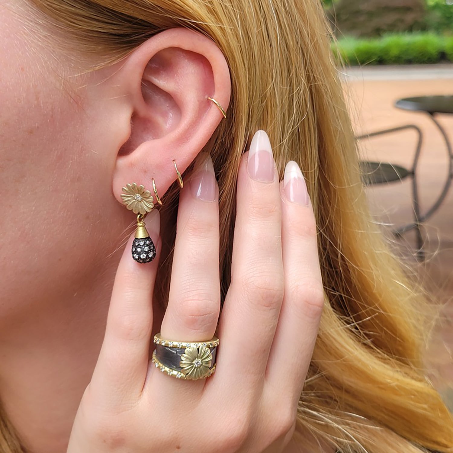 Oxidized Silver Feather Band with Diamond Edges and Shasta Daisy on white female model | Rebecca Myers Collection