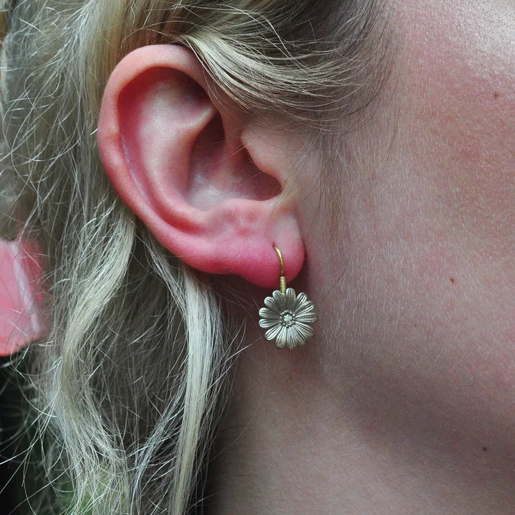 Small White Gold Shasta Daisy Earrings on white female model with blonde hair | Rebecca Myers Collection