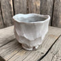 Logan Wannamaker White Ceramic Pine Cone Cup on rustic background | Rebecca Myers Collection
