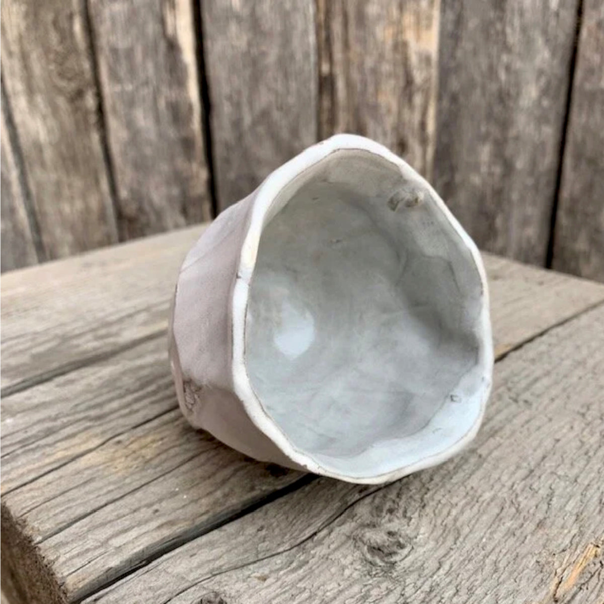 Logan Wannamaker White Ceramic Pine Cone Cup on rustic background view from top | Rebecca Myers Collection