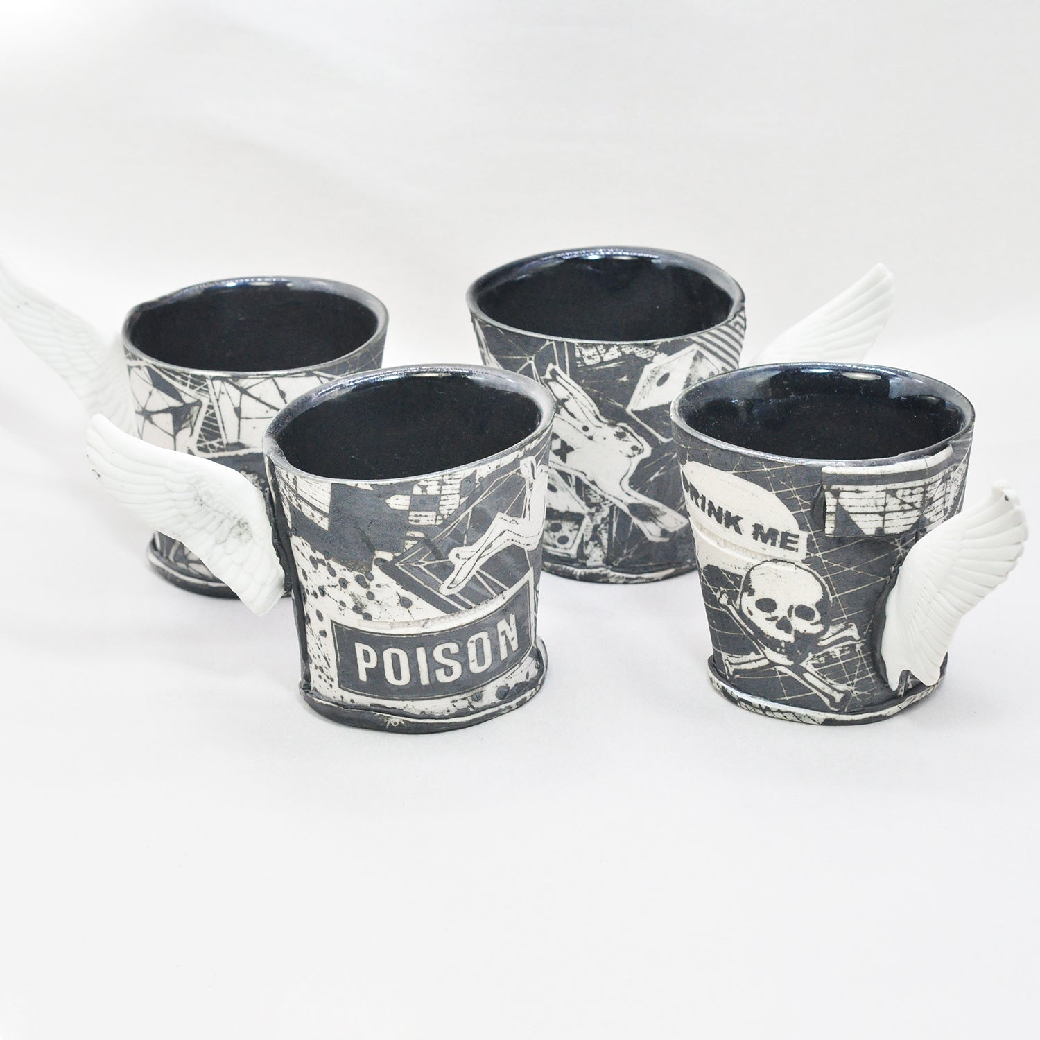 Black & White Winged Cups by Mimi Logothetis, set of four front view | Rebecca Myers Collection