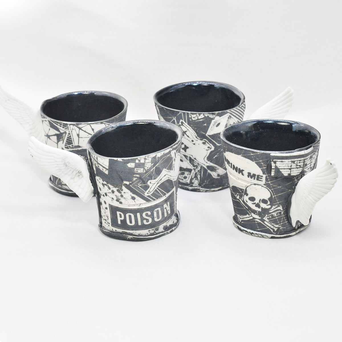 Black & White Winged Cups by Mimi Logothetis, set of four front view | Rebecca Myers Collection