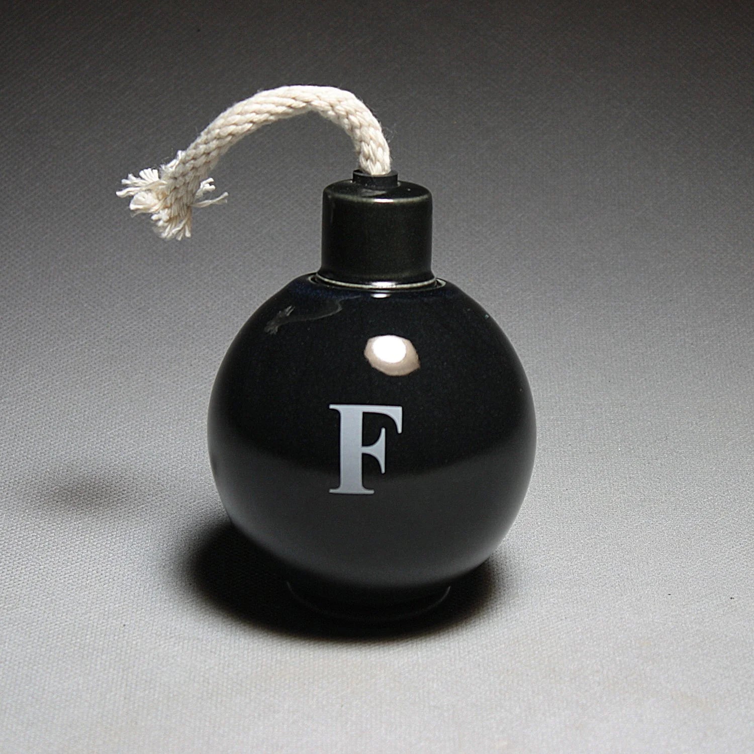 Small ceramic sculpture of F-Bomb by Michael Schwegmann | Rebecca Myers Collection
